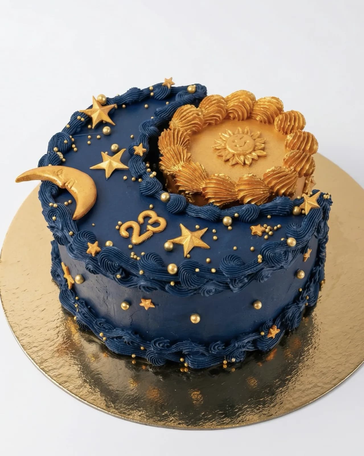 Navy and gold celestial birthday cake with a moon, stars and a baroque sun, a custom cake by Cakes By Vjollca in Pristina, Kosovo