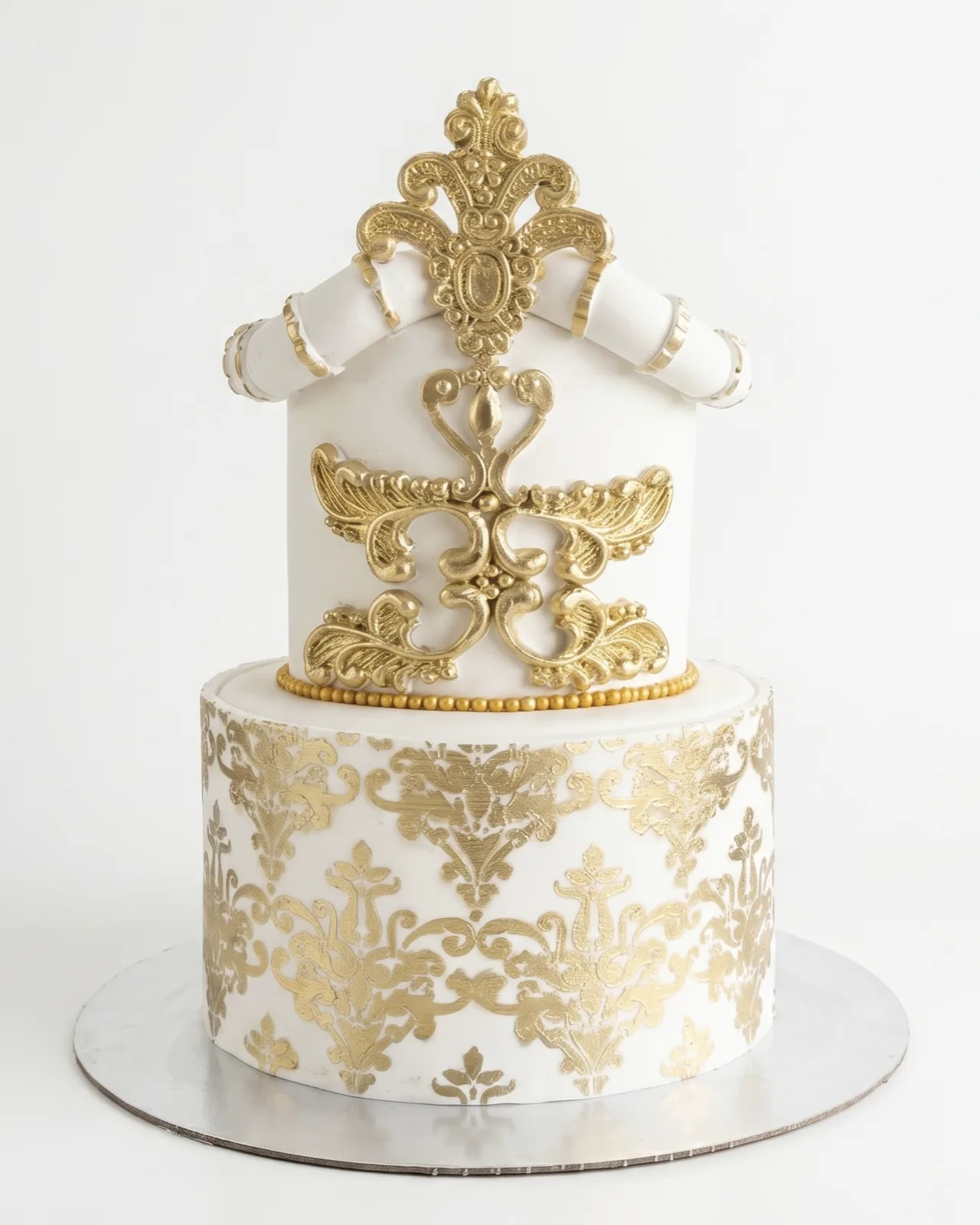White and gold baroque celebration cake with ornate damask piping, a custom cake by Cakes By Vjollca in Pristina, Kosovo