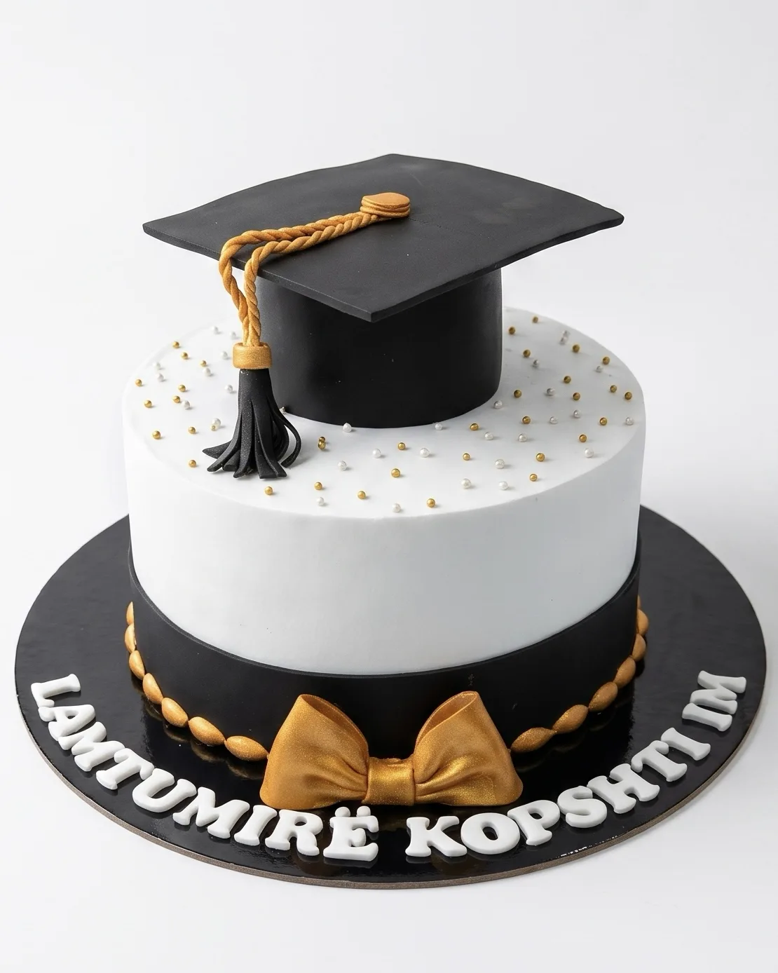 Black and white graduation cake with a fondant graduation cap, handmade by Cakes By Vjollca in Pristina, Kosovo